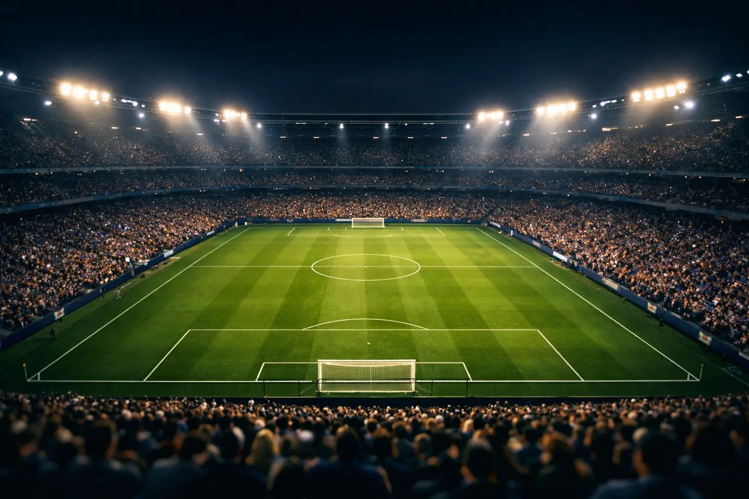Stadio di calcio illuminato durante una partita serale